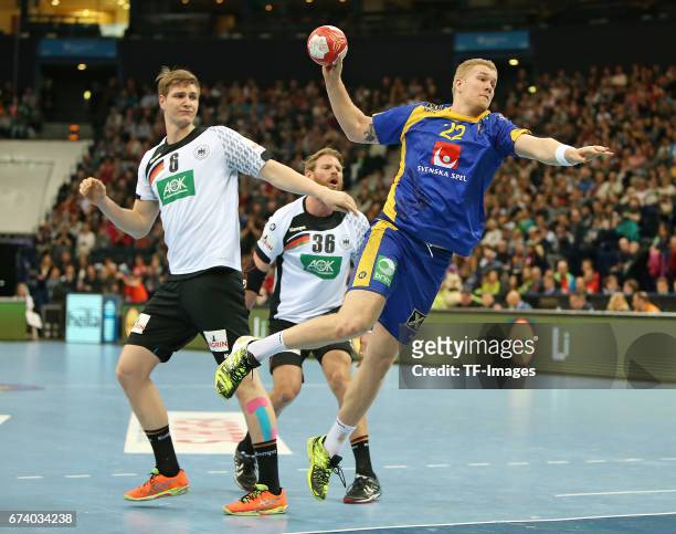 March 19: Finn Lemke of Germany and Manuel Spaeth of Germany and Anton Lindskog of Sweden battle for the ball during the match Germany vs. Sweden at...