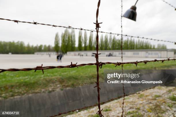 View of the fence at Dachau Concentration Camp on April 14, 2017 in Dachau, Germany. Dachau was the first Nazi concentration camp and began operation...