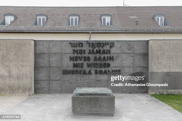 Memorial at the camp with Never again written in several languages on April 14, 2017 in Dachau, Germany. Dachau was the first Nazi concentration camp...