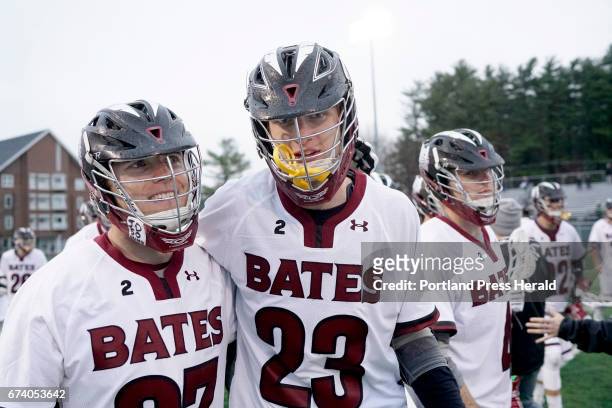 Sam Francis and Charlie Fay of the Bates men's lacrosse team celebrate their undefeated regular season after a win over Colby in the finale,...