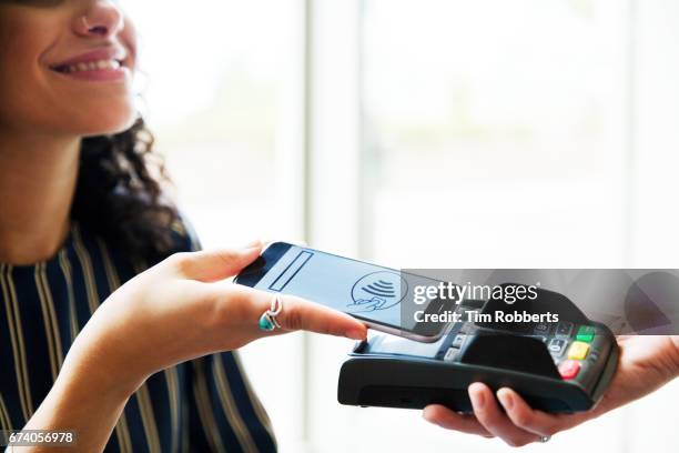close up of mobile payment - contactless stock pictures, royalty-free photos & images