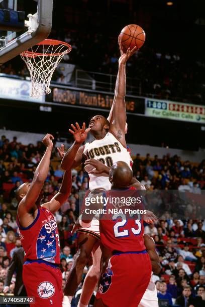 Laphonso Ellis of the Denver Nuggets shoots against the Philadelphia 76ers circa 1994 at the McNichols Sports Arena in Denver, Colorado. NOTE TO...