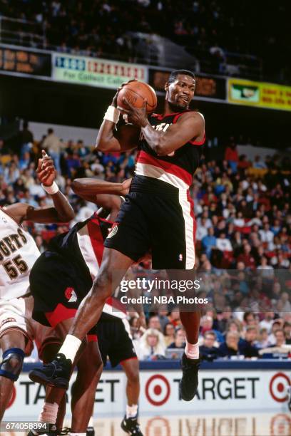 Jerome Kersey of the Portland Trail Blazers rebounds against the Denver Nuggets circa 1994 at the McNichols Sports Arena in Denver, Colorado. NOTE TO...
