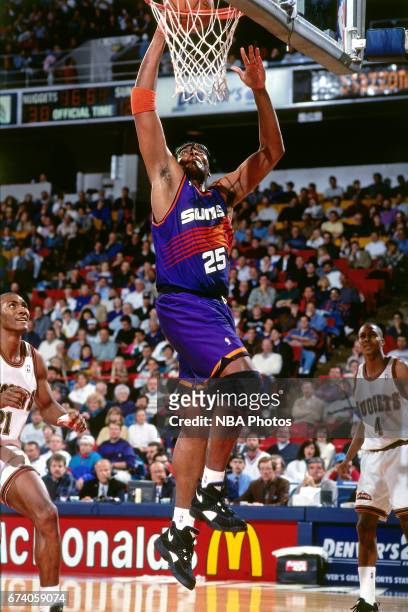 Oliver Miller of the Phoenix Suns shoots against the Denver Nuggets circa 1994 at the McNichols Sports Arena in Denver, Colorado. NOTE TO USER: User...