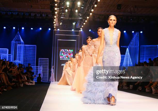 Models present creations of Portugal designer Joao Rolo during the Vietnam International Fashion Week 2017 in Ho Chi Minh City, Vietnam, on April 26,...