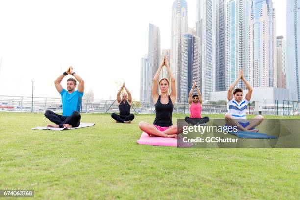 finding zen with yoga - yoga office arab stock pictures, royalty-free photos & images