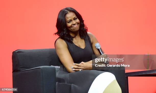 Former United States first lady Michelle Obama smiles during the AIA Conference on Architecture 2017 on April 27, 2017 in Orlando, Florida. Michelle...