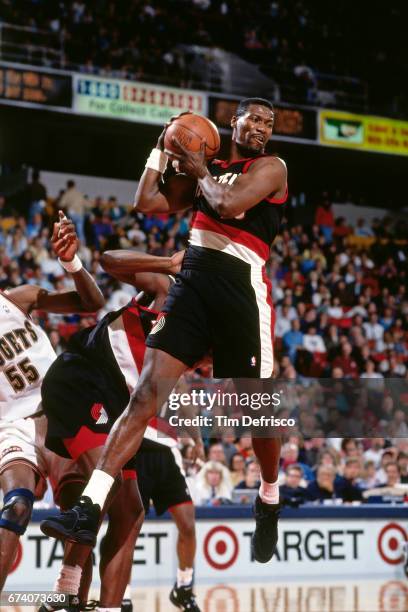 Jerome Kersey of the Portland Trail Blazers rebounds against the Denver Nuggets circa 1994 at the McNichols Sports Arena in Denver, Colorado. NOTE TO...