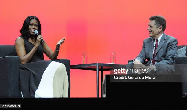 Former United States first lady Michelle Obama speaks as Thomas Vonier, President, American Institute of Architects looks on during a conversation at...