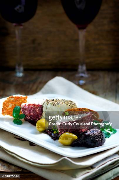 fresh goat cheeses in various breading with wholegrain crispbreads - quince restaurant stock pictures, royalty-free photos & images