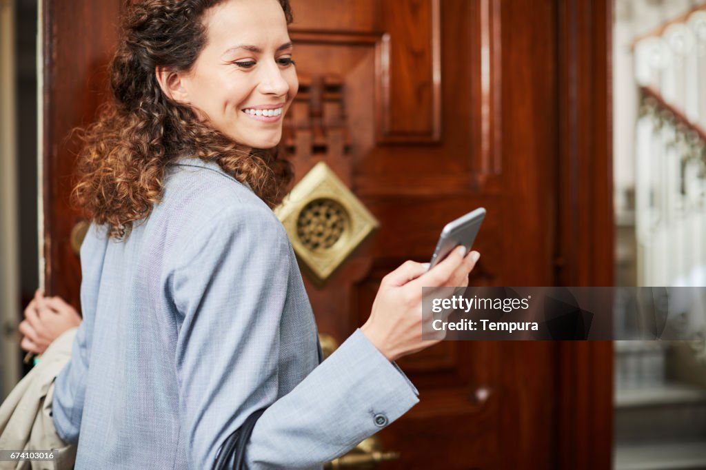 Single, businesswoman getting ready in the morning.