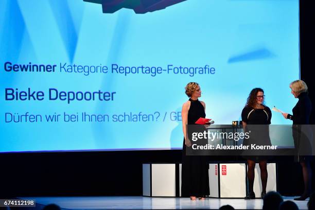 Caren Miosga, 'Best Reportage Photography' Award Winner Bieke Depoorter and jury member Regina Schmecken speak on stage at the Nannen Award 2017 on...