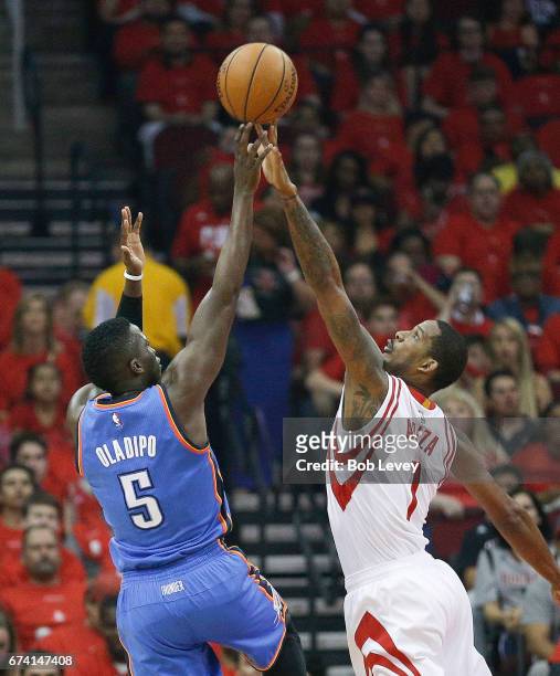 Victor Oladipo of the Oklahoma City Thunder has his shot blocked by Trevor Ariza of the Houston Rockets during Game Five of the Western Conference...