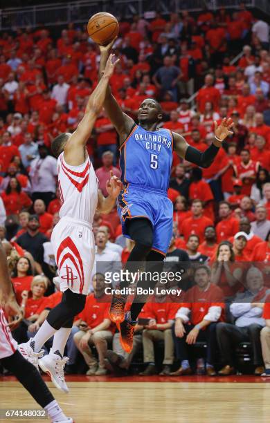 Victor Oladipo of the Oklahoma City Thunder shoots over Eric Gordon of the Houston Rockets during Game Five of the Western Conference Quarterfinals...