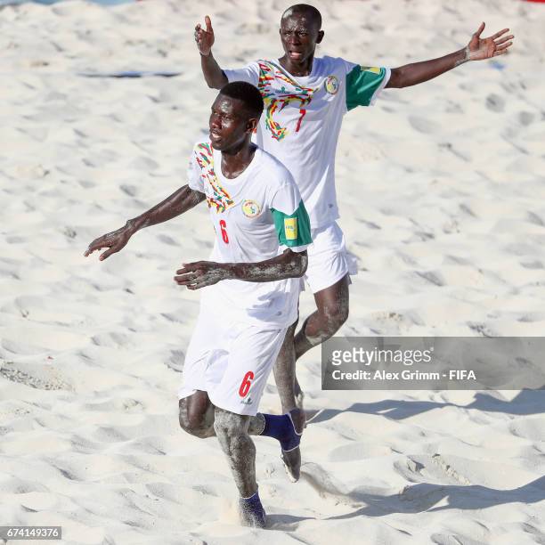 Papa Ndoye of Senegal celebrates a goal with team mate Babacar Fall during the FIFA Beach Soccer World Cup Bahamas 2017 group A match between Ecuador...