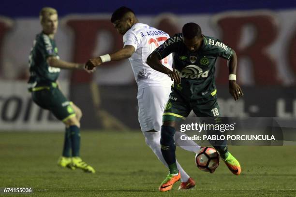 Brazil's Chapecoense midfielder Luiz Antonio vies for the ball with Uruguay's Nacional player Rodrigo Aguirre during their Copa Libertadores 2017...