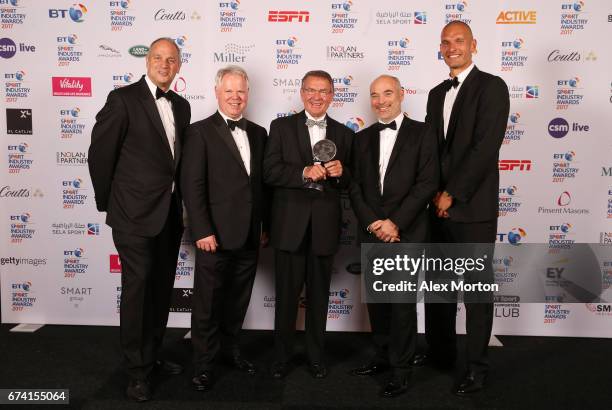 Jurgen Grobler poses with the Coutts Lifetime Achievement award and Sir Steve Redgrave and Mo Sbihi during the BT Sport Industry Awards 2017 at...