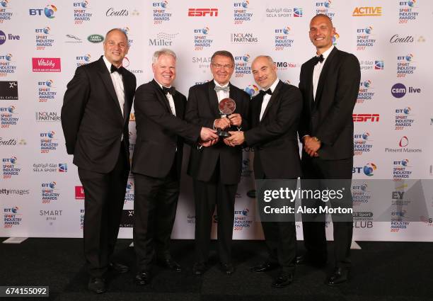 Jurgen Grobler poses with the Coutts Lifetime Achievement award and Sir Steve Redgrave and Mo Sbihi during the BT Sport Industry Awards 2017 at...