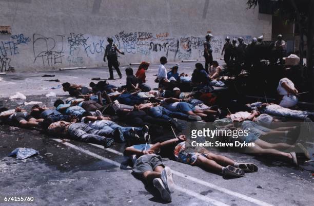County Sheriffs surround alleged looters on Vermont at ML King Blvd on April 30, 1992 in Los Angeles, California.