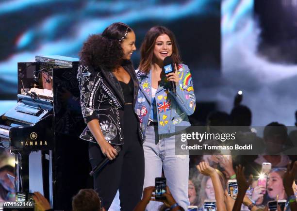 Singer Alicia Keys and host of WE Day California, actress/singer and UNICEF Goodwill Ambassador Selena Gomez onstage at WE Day California to...