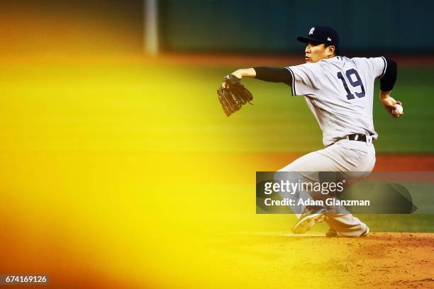 Masahiro Tanaka of the New York Yankees delievers in the first inning of a game against the Boston Red Sox at Fenway Park on April 27, 2017 in...