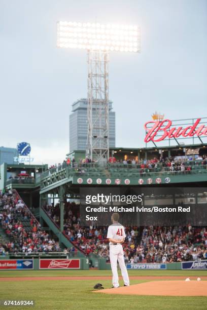 Chris Sale of the Boston Red Sox stands for the national anthem before the start of a game against the New York Yankees at Fenway Park on April 27,...