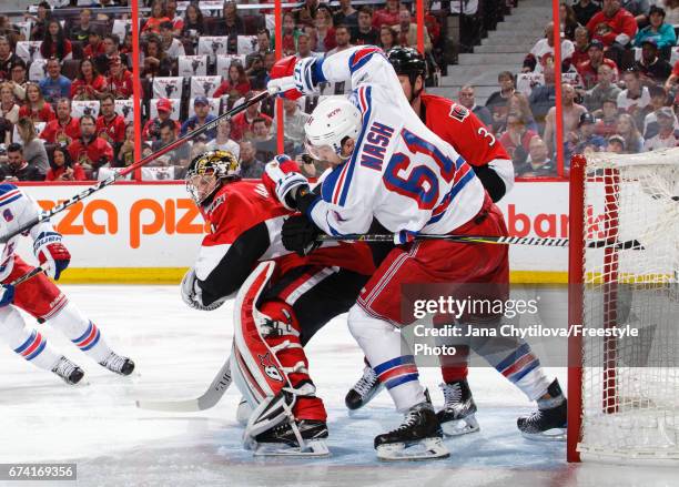 Craig Anderson and Marc Methot of the Ottawa Senators defend against Rick Nash of the New York Rangers in Game One of the Eastern Conference Second...