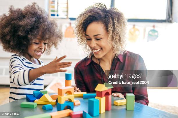 playing and learning - learning generation parent child stock pictures, royalty-free photos & images