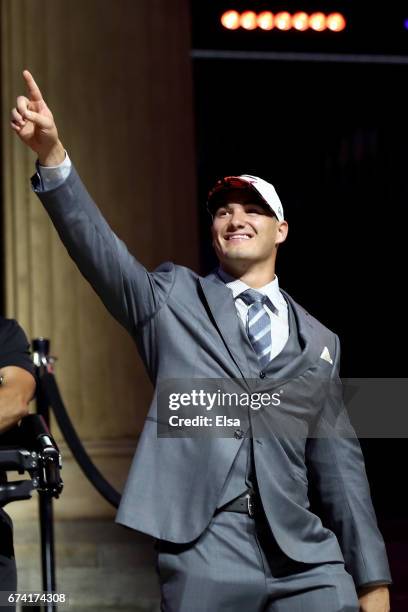 Mitchell Trubisky of North Carolina reacts after being picked overall by the Chicago Bears during the first round of the 2017 NFL Draft at the...