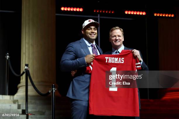 Solomon Thomas of Stanford poses with Commissioner of the National Football League Roger Goodell after being picked overall by the San Francisco...