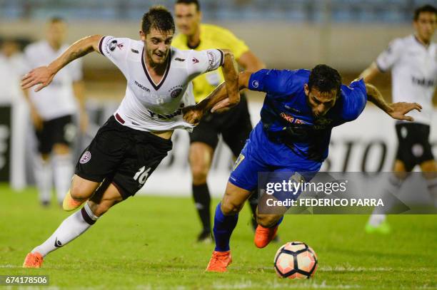 Alejandro Silva of Argentina's Lanus vies for the ball with Edixon Cuevas of Venezuela's Zulia during their Copa Libertadores 2017 football match...