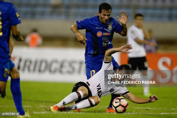 Alejandro Silva of Argentina's Lanus vies for the ball with Edixon Cuevas of Venezuela's Zulia during their Copa Libertadores 2017 football match...