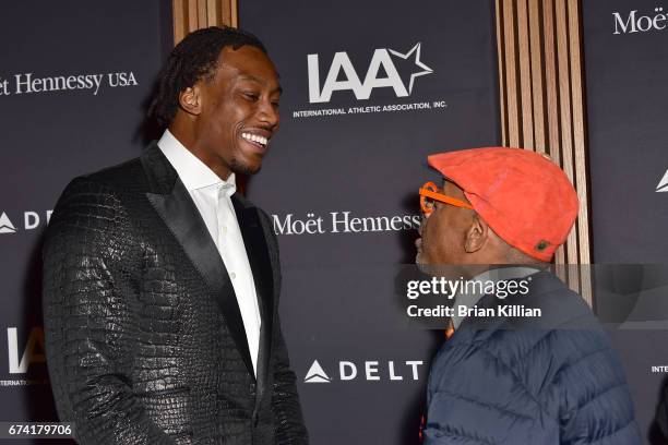 Wide receiver Brandon Marshall talks with director Spike Lee during the 2017 Jesse Owens International Athlete Trophy Gala at Jazz at Lincoln Center...