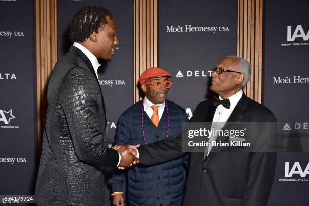 Wide receiver Brandon Marshall, director Spike Lee and co-founder of the Jesse Owens Foundation Herbert P Douglas attend the 2017 Jesse Owens...