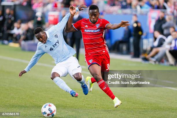 Sporting Kansas City forward Gerso and FC Dallas defender Maynor Figueroa fight for a ball during the MLS match between Sporting KC and FC Dallas on...