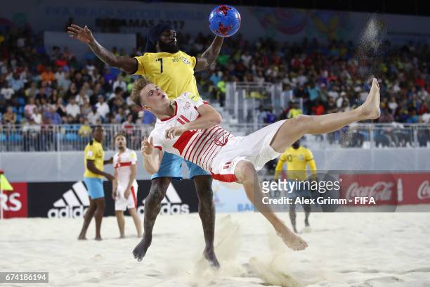 Glenn Hodel of Switzerland is challenged by Nesly Jean of Bahamas during the FIFA Beach Soccer World Cup Bahamas 2017 group A match between Bahamas...