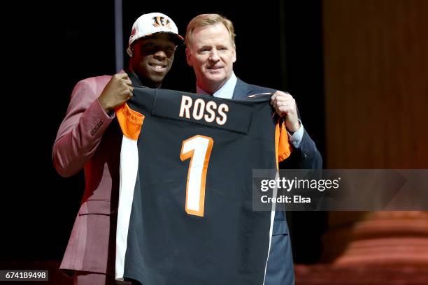 John Ross of Washington poses with Commissioner of the National Football League Roger Goodell after being picked overall by the Cincinnati Bengals...