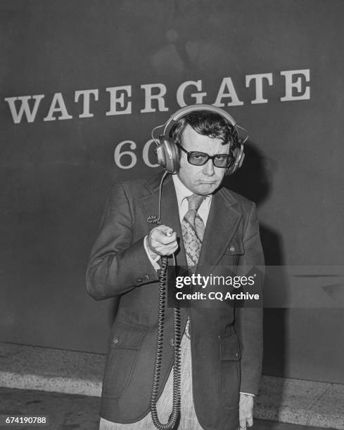 Mark Russell wearing a headphone at Watergate complex.