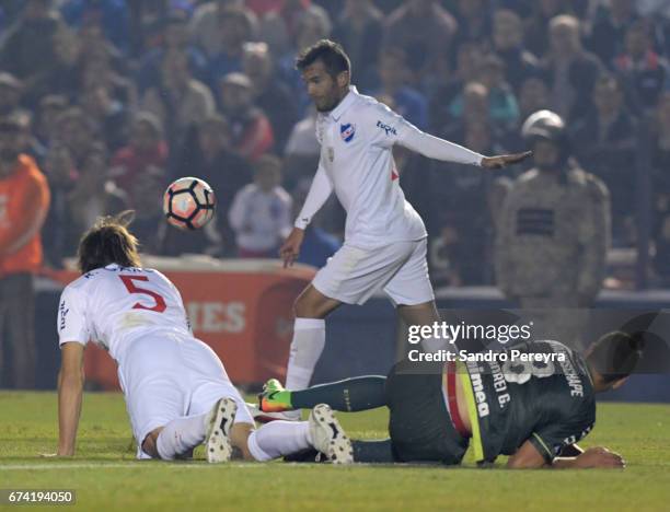 Alvaro Gonzalez of Nacional and Andrei Girotto of Chapecoense fight the ball during a match between Nacional and Chapecoense as part of Copa CONMEBOL...