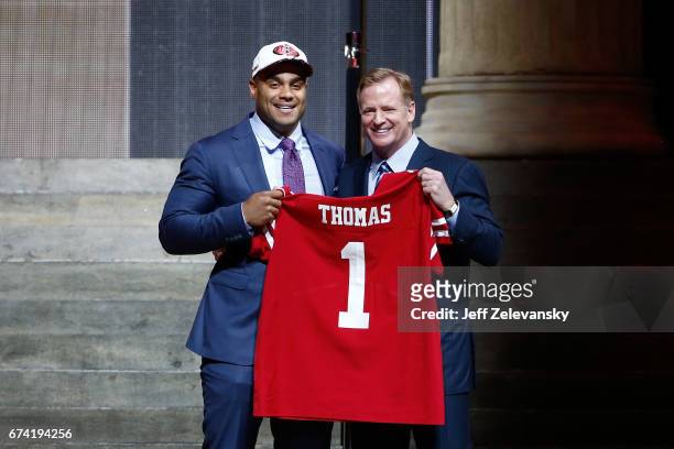 Solomon Thomas of Stanford poses with Commissioner of the National Football League Roger Goodell after being picked overall by the San Francisco...