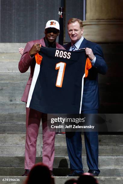 John Ross of Washington poses with Commissioner of the National Football League Roger Goodell after being picked overall by the Cincinnati Bengals...