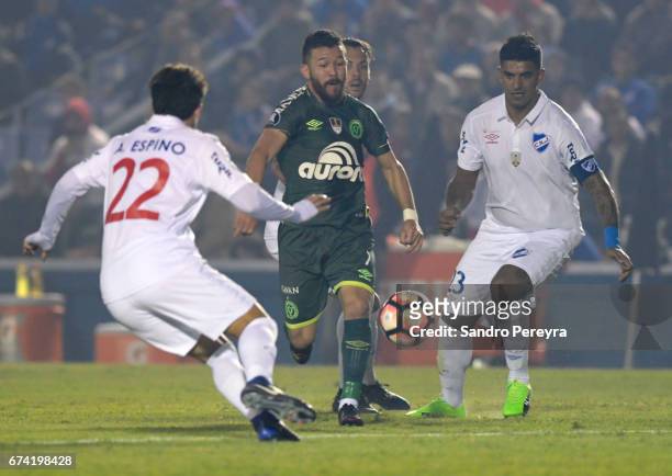 Rossi of Chapecoense and Diego Polenta of Nacional fight for the ball during a match between Nacional and Chapecoense as part of Copa CONMEBOL...