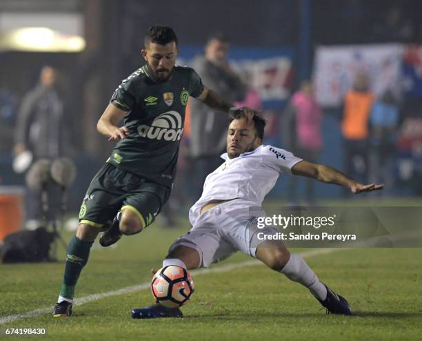 Rossi of Chapecoense and Sebastian Rodriguez of Nacional fight for the ball during a match between Nacional and Chapecoense as part of Copa CONMEBOL...