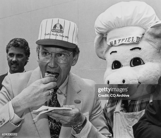 Sen. Larry Craig, R-Idaho., eating super tuber at National Hot Dog Month on July 24, 1992.