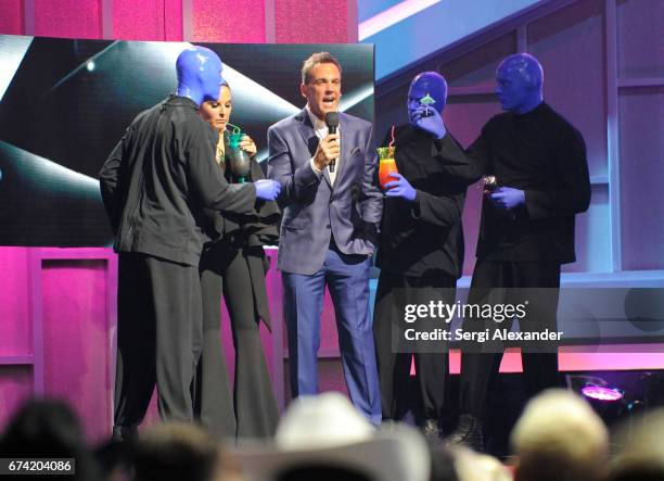 Hosts Kate del Castillo and Carlos Ponce with Blue Man Group onstage at the Billboard Latin Music Awards at Watsco Center on April 27, 2017 in Coral...