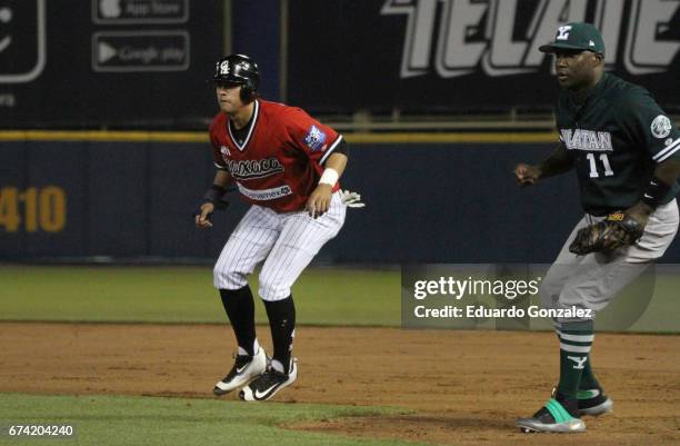 Miguel Rodríguez of Guerreros de Oaxaca and Yuniesky Betancourt of Leones de Yucatán in action during the match between Leones de Yucatan and...