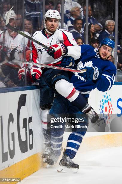 Zach Hyman of the Toronto Maple Leafs collides with Matt Niskanen of the Washington Capitals during the third period in Game Six of the Eastern...