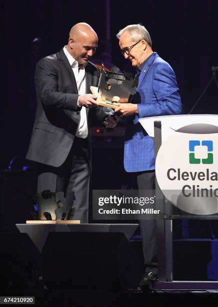 Former tennis player Andre Agassi accepts the Community Achievement Award from Keep Memory Alive Co-Founder Larry Ruvo during the 21st annual Keep...