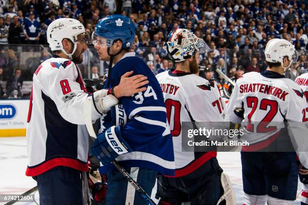 Auston Matthews of the Toronto Maple Leafs shakes hands with Alex Ovechkin of the Washington Capitals after the Captials defeated the Maple Leafs in...