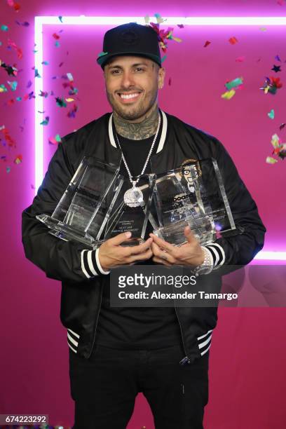 Nicky Jam poses with awards in the press room during the Billboard Latin Music Awards at Watsco Center on April 27, 2017 in Coral Gables, Florida.